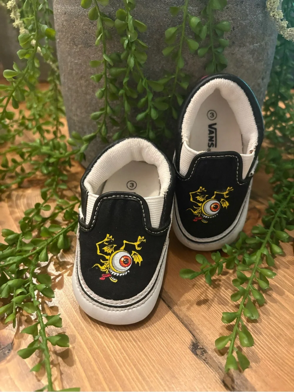 Vans Kids Black Slip-On Sneakers with Yellow and Red Monster Eyeball